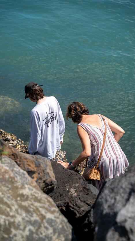 My brother (left) and mom (right) wandering near the ocean