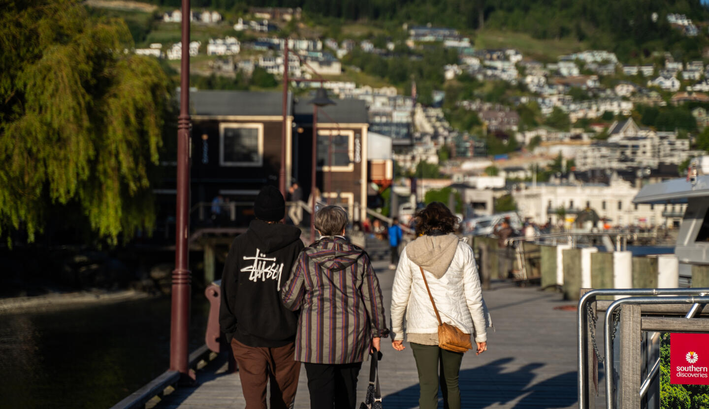 My brother (left), grandma (center), and mom (right) with Queenstown NZ in the background