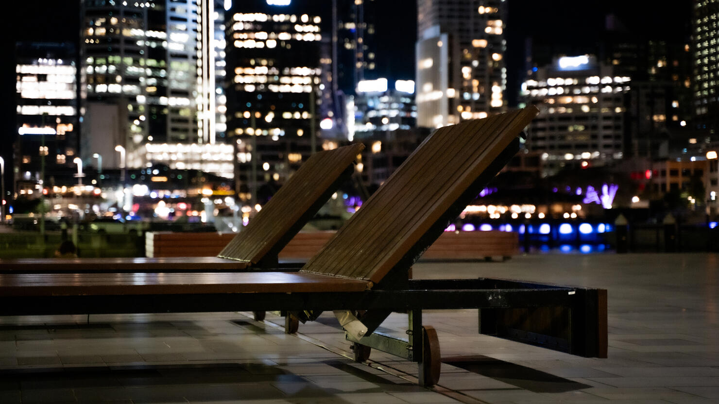 Chairs in the nighttime Auckland cityscape