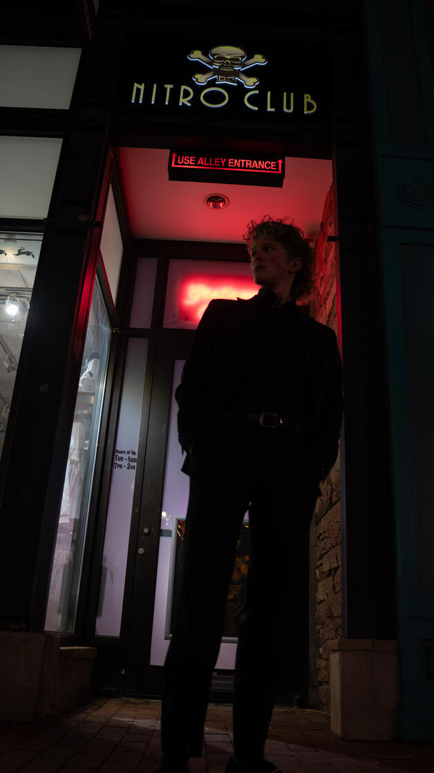 Drew looking majestic in front of a Nightclub